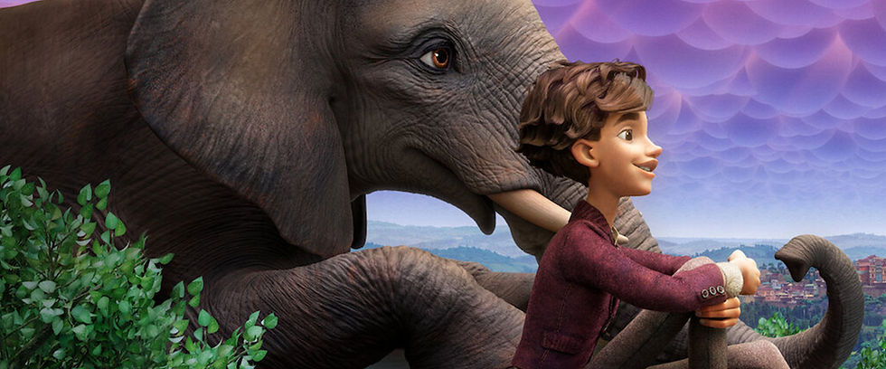 a boy sitting with an elephant on a hill above a city