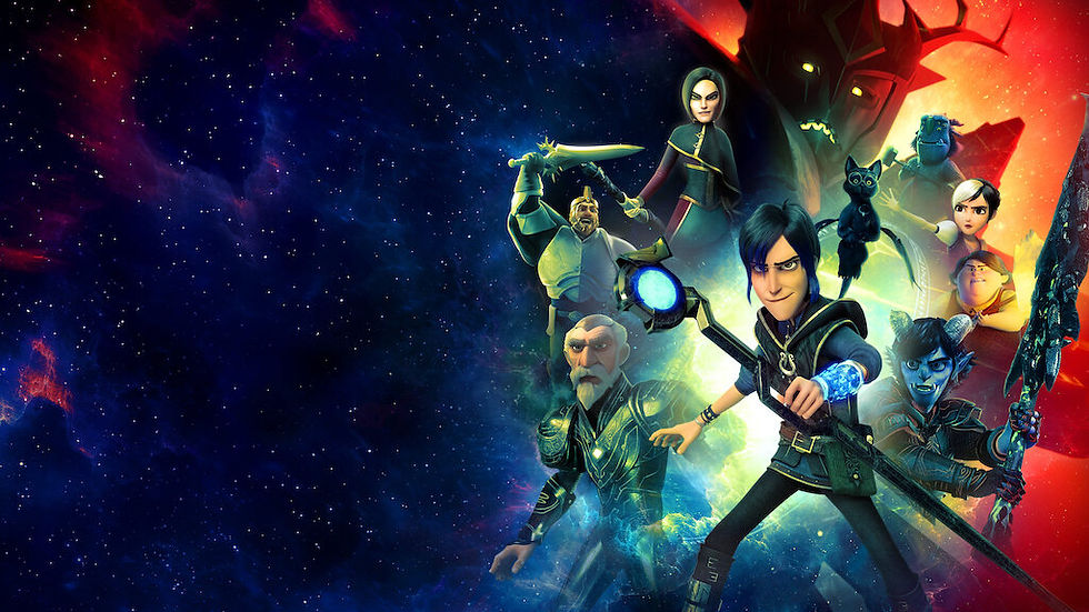a group of wizards stand and a winged cat stand behind a wizard holding out a magic staff