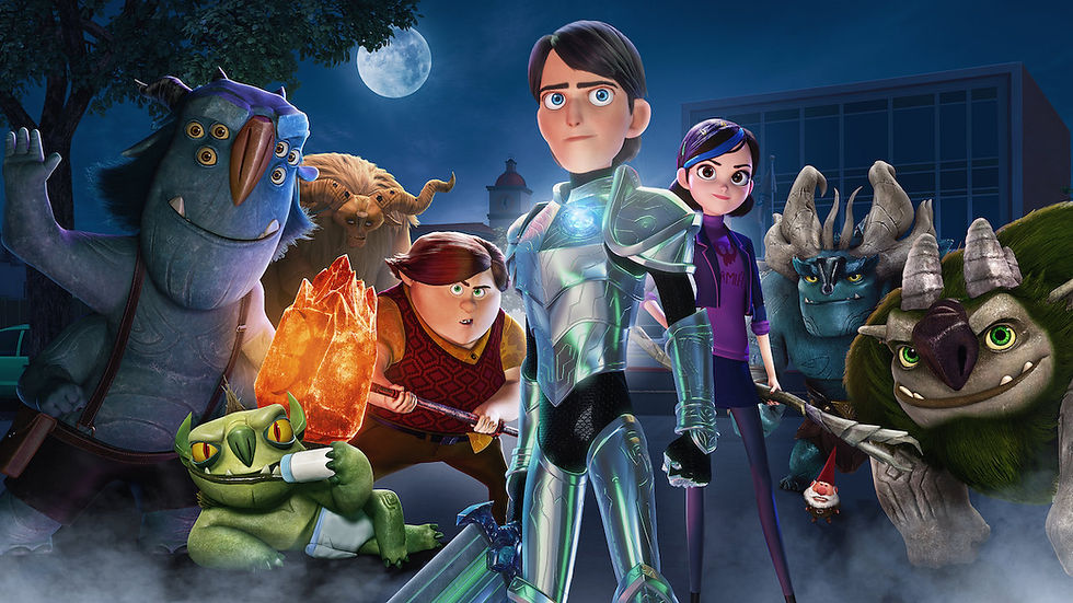 a boy in armour stands in front of his friends, a boy and and girl, flanked by some friendly looking trolls