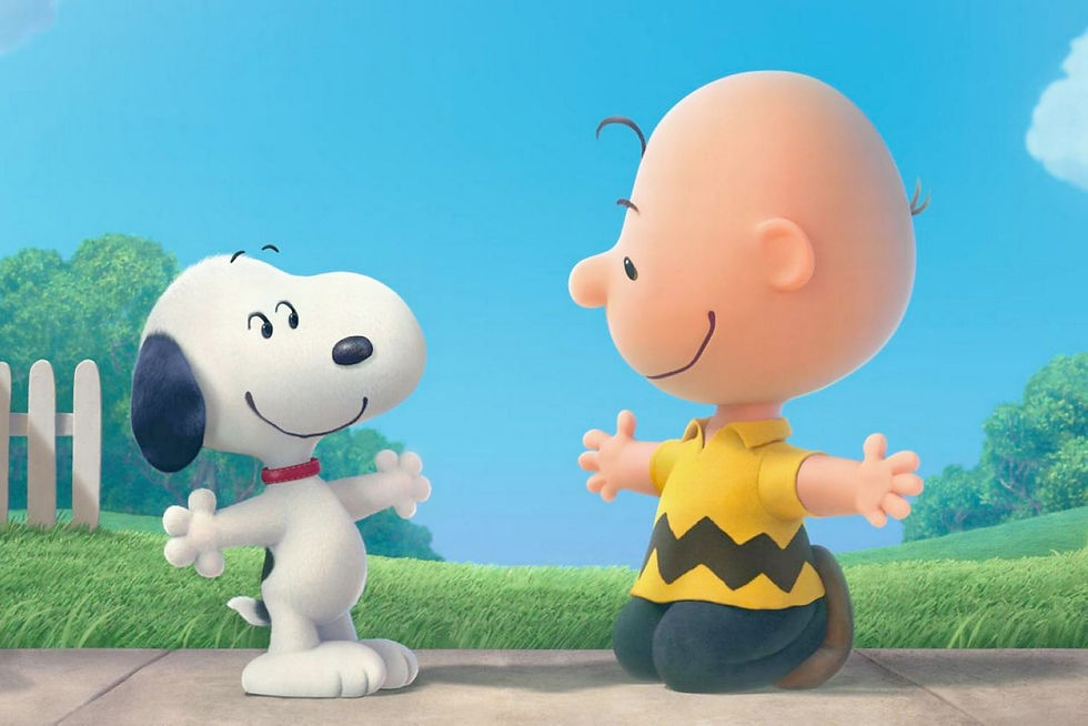 boy in a yellow shirt is about to hug his white dog. they both have their outstretched