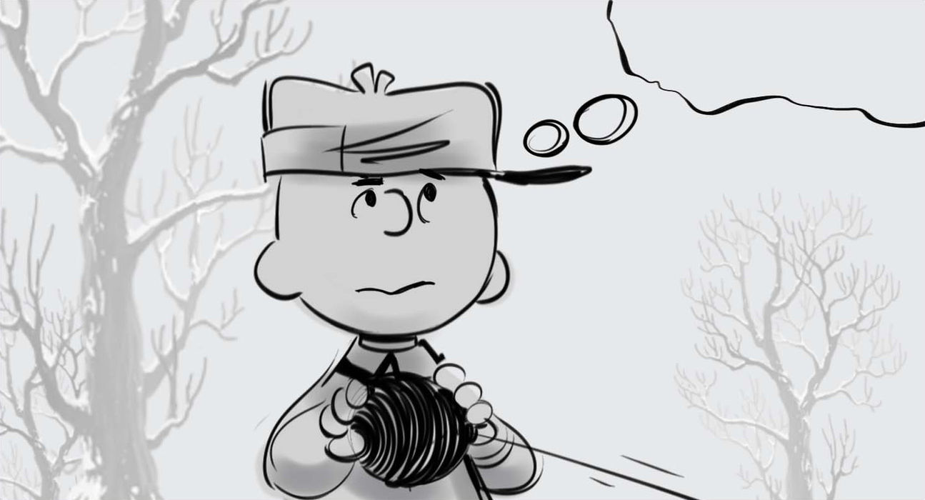 a boy holding an ball of string