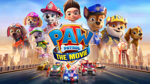 seven dogs in different uniforms from police to firefighter, and a boy in front of a bridge full of police and firetrucks and a city skyline